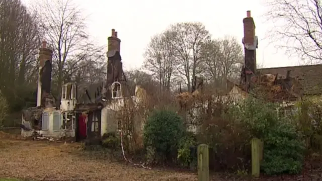 The Purdys' thatched cottage