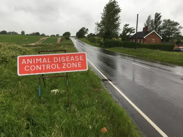 Sign warning drivers of animal disease control zone