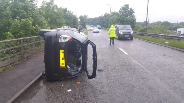 Car on it's side on A52 slip road