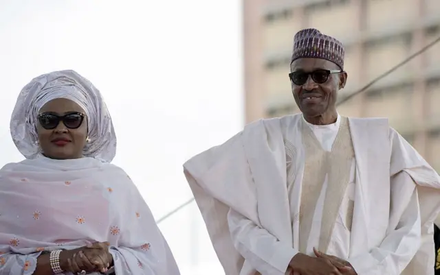 Nigerian President Mohammadu Buhari arrives with his wife Aisha, before taking oath of office at the Eagles Square in Abuja, on May 29, 2015.