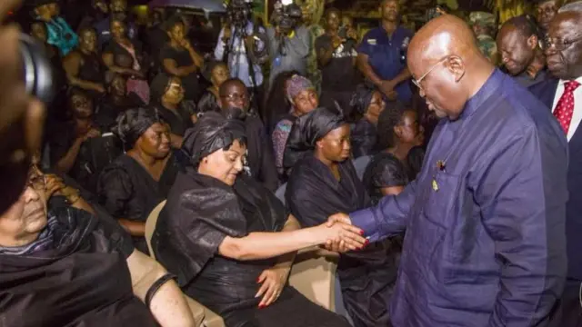 The president shaking the widow's hand