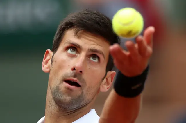 Novak Djokovic prepares to serve