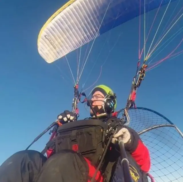 Giles Fowler in his paraglider