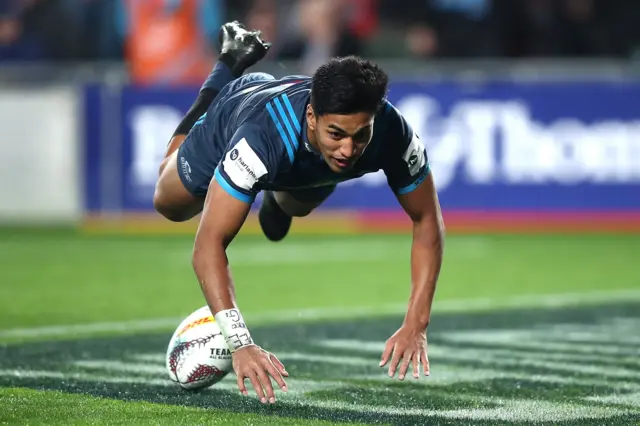 Rieko Ioane of the Blues dives over the line