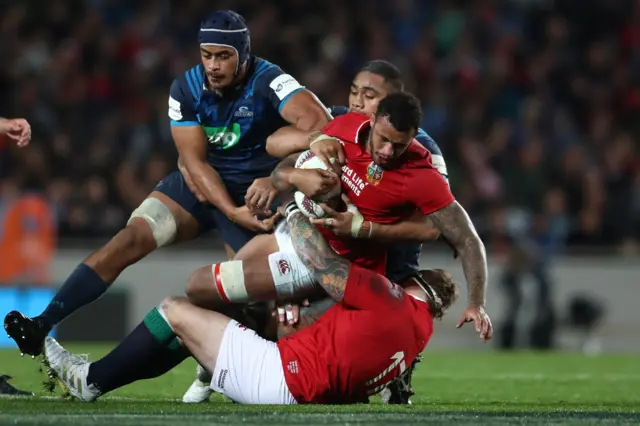 Courtney Lawes is tackled