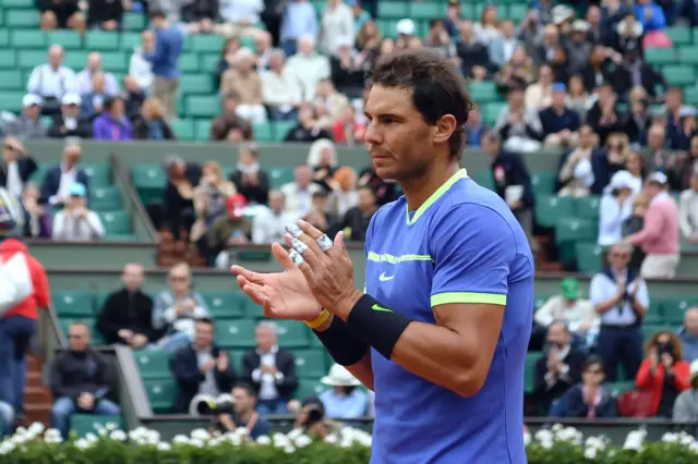 Rafael Nadal applauds