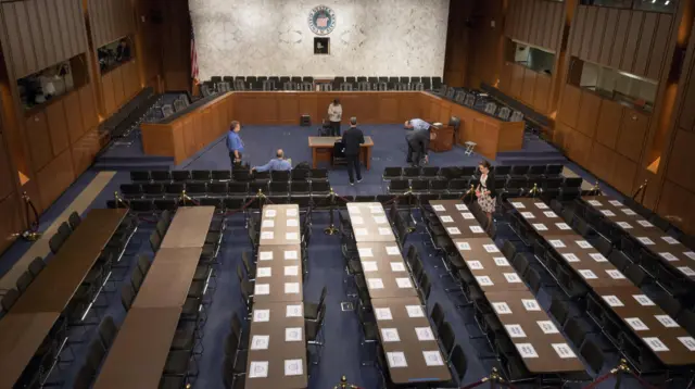 Rows of tables have been set up for the press