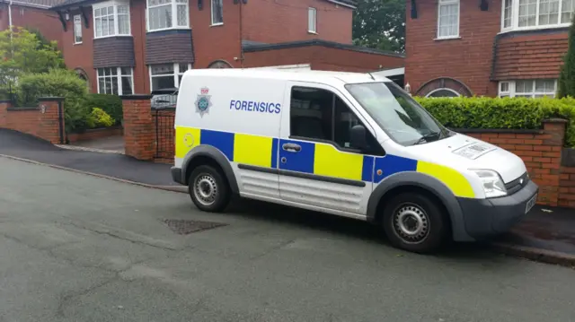 Forensic van parked on street