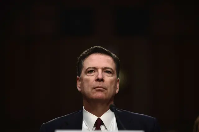 Comey's face giving nothing away yet