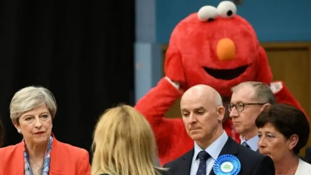 Theresa May and 'Elmo' share the stage