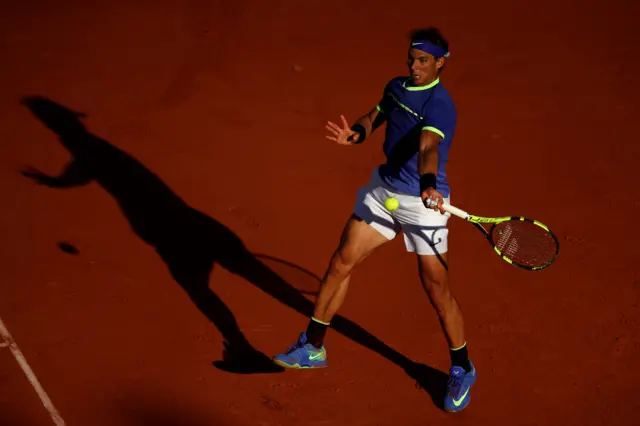 Rafael Nadal of Spain hits a forehand