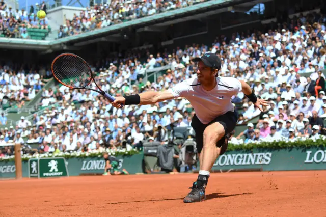 Andy Murray reaches to return the ball