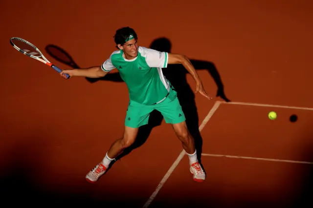 Dominic Thiem of Austria hits a forehand