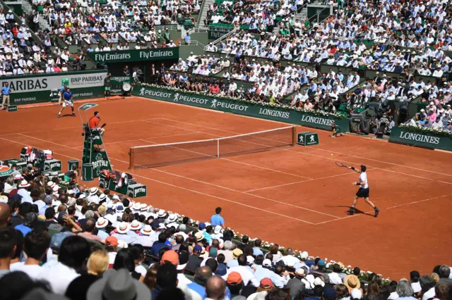 Andy Murray plays a shot against Stan Wawrinka