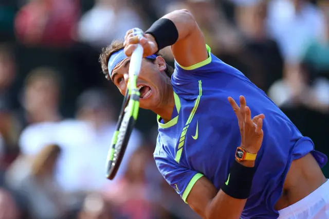 Rafael Nadal serves