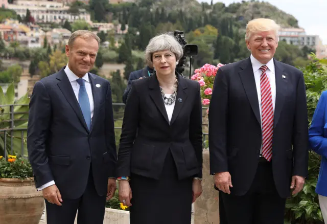 G7 leaders European Council President Donald Tusk, British Prime Minister Theresa May and U.S. President Donald Trump attend a flypast at San Domenico Palace Hotel in Taormina