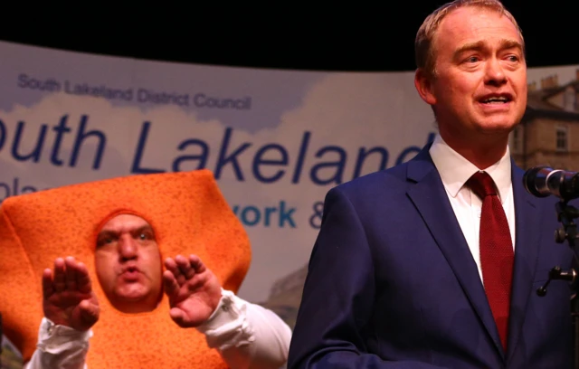 Tim Farron and Mr Fishfinger (left)