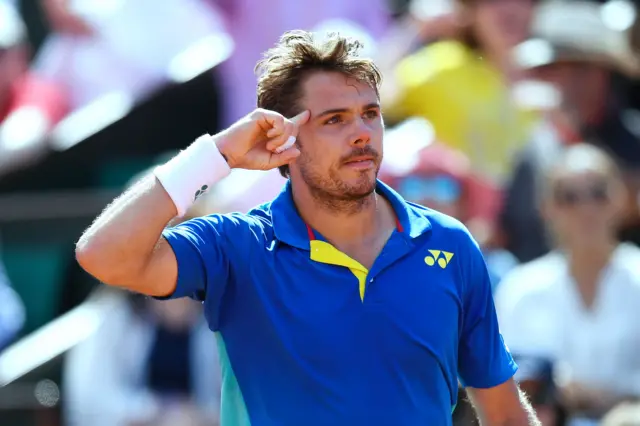 Wawrinka reacts after scoring a point