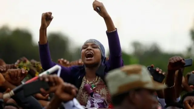 Protester raising her fists