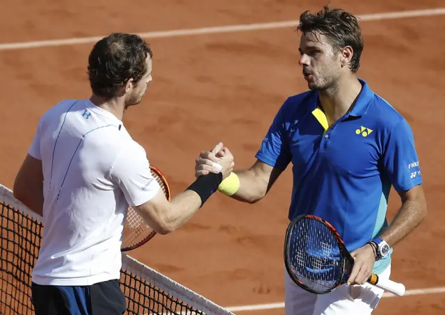 Stanislas Wawrinka of Switzerland shakes hands with Andy Murray