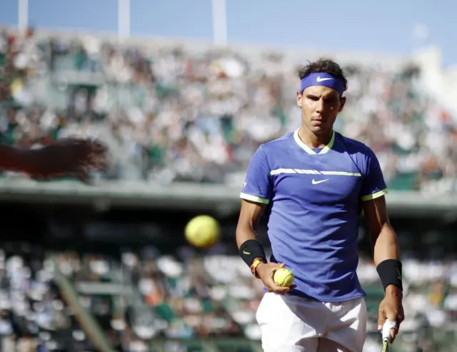 Rafael Nadal looks on