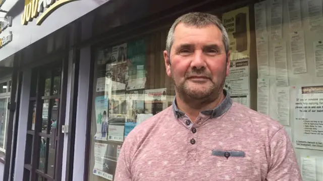 Tommy works at a job centre on the Shankhill Road in Belfast.