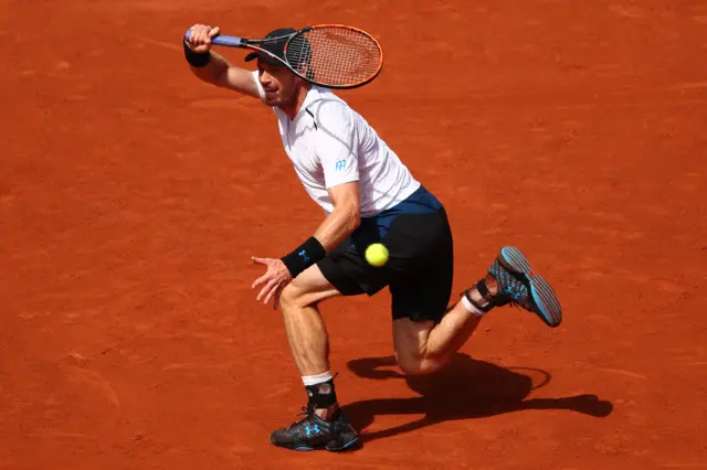 Andy Murray runs for the ball