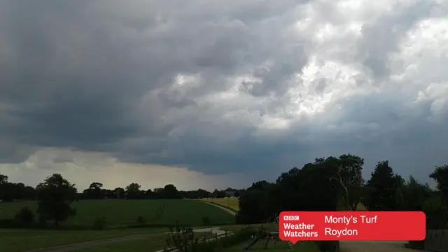 Dark sky over open land