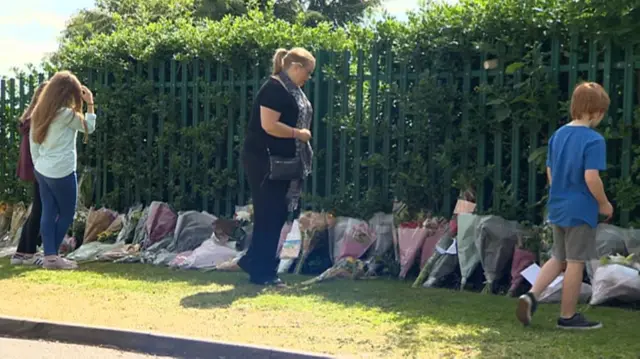 Flowers laid after Holly Brown dies in bus crash