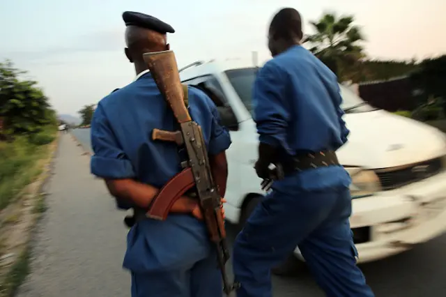 Police check cars for weapons on the outskirts of an opposition neighborhood on June 28, 2015 in Bujumbura, Burundi.