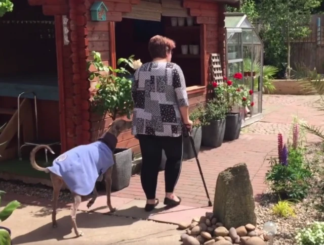 Janet Voyce in her garden