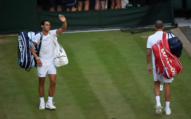 Rafael Nadal waves to fans