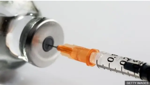 Needle into vaccine