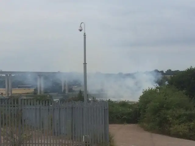 Smoke rising from sewage treatment site