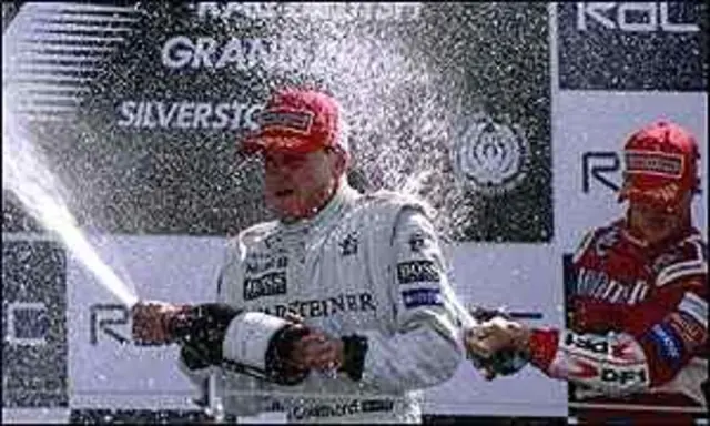 David Coulthard celebrates winning the British GP at Silverstone in 1999