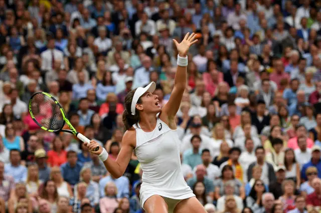 Konta serves