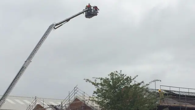 Fire crew on aerial platform