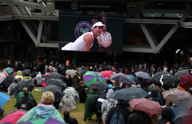 Spectators watch Konta