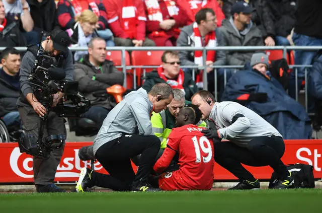 Sadio Mane of Liverpool receives treatment from the medical team during the Premier League match between Liverpool and Everton at Anfield on April 1, 2017 in Liverpool, England.