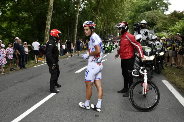 Arthur Vichot waits for a new bike