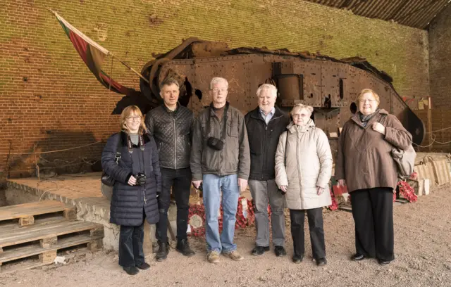 People in front of a World War One tank