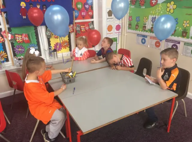 Pupils wearing football shirts