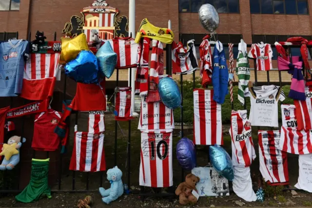 Football shirts and other items left as tributes