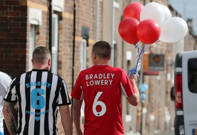 Men wear Sunderland and Newcastle shirts with Bradley's name on them