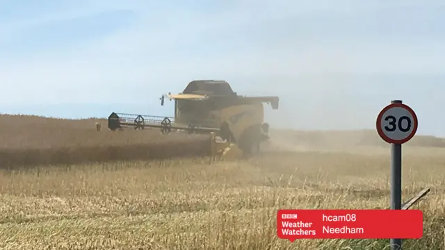 Harvester in field