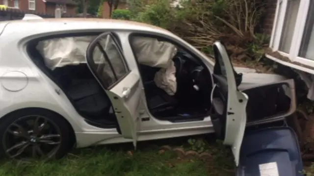 A car crashed into the front of a house in Birmingham