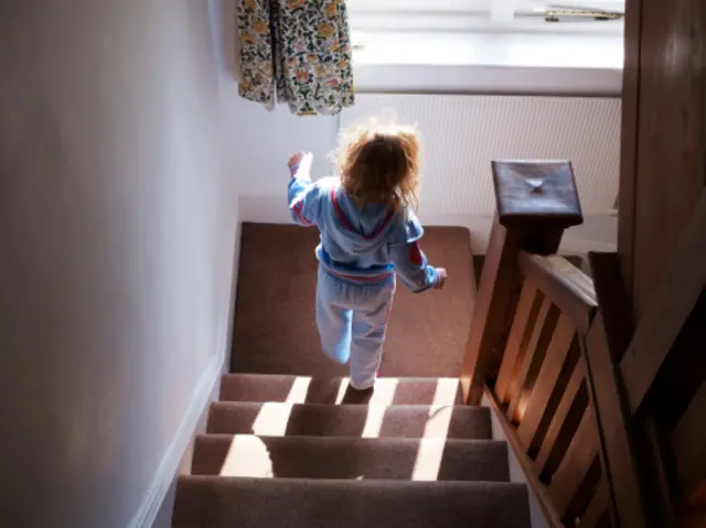 Child alone on stairs