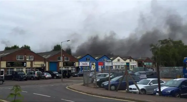 Black smoke over industrial area