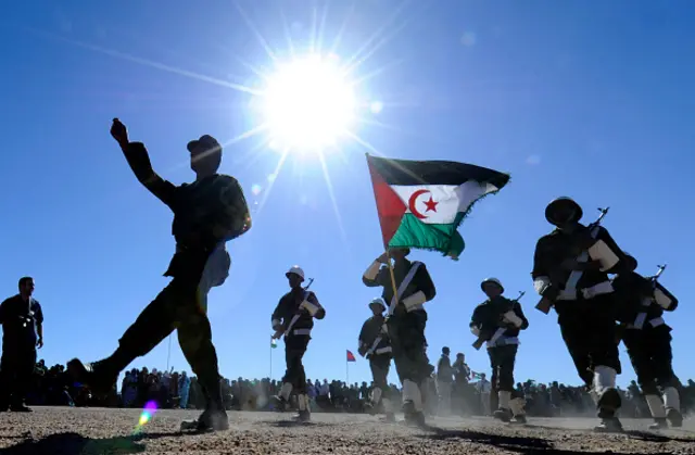 Soldiers from the Pro-independence Polisario Front parade during a ceremony marking the 35th anniversary of the proclamation of independence of the Sahrawi Arab Democratic Republic in the Western Sahara village of Tifariti on February 27, 2011