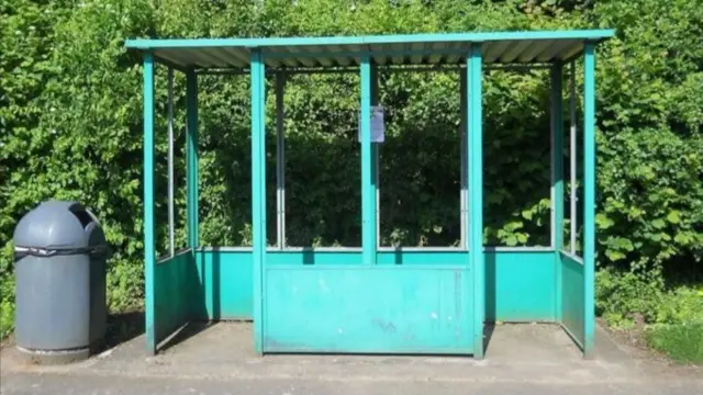 The bus shelter before the painting